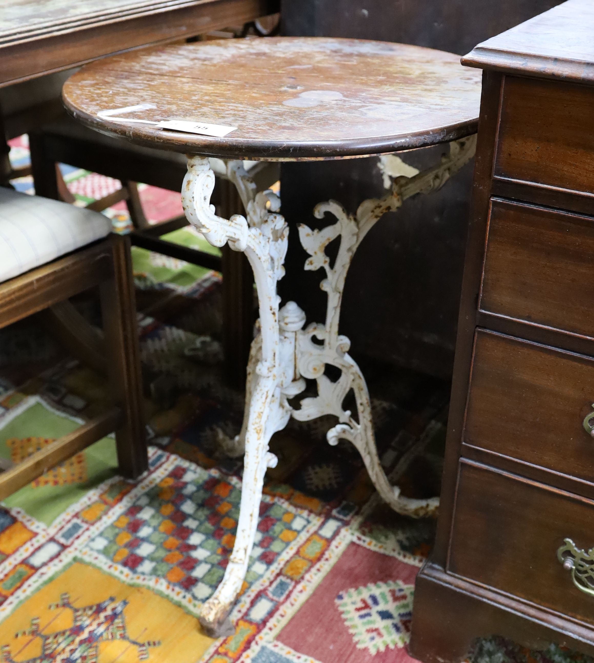 A Victorian cast iron tripod pub table with circular mahogany top, diameter 53cm, height 71cm